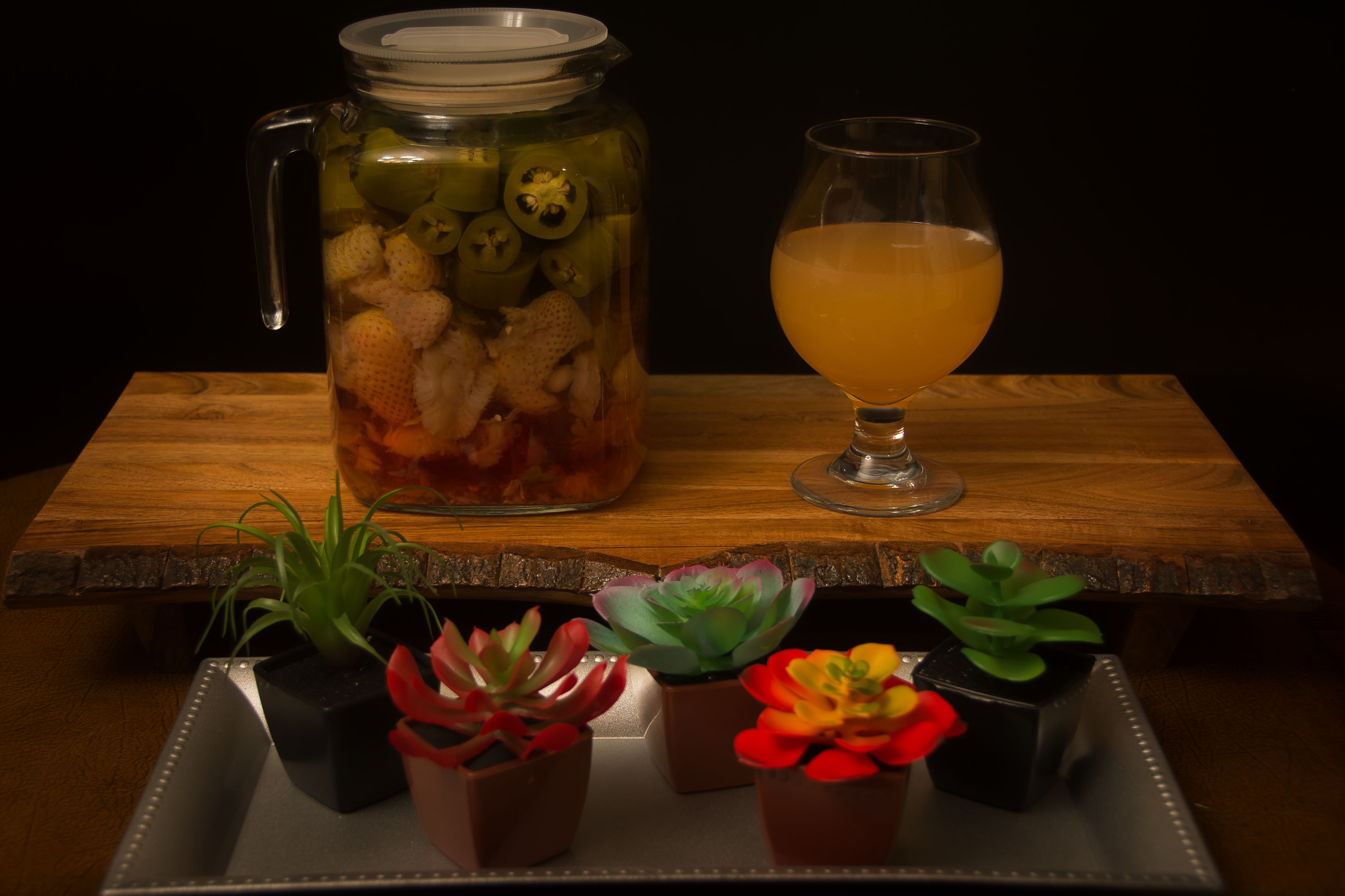 Homemade jalapeno and strawberry infused tequilla for spicy margaritas